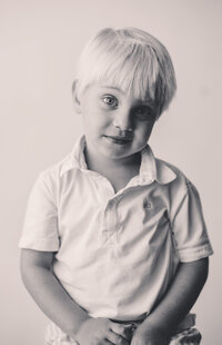 Young boy peers into the camera during Personality Portraits in Charleston, South Carolina.