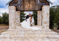 Bride and groom portrait taken during a wedding session at Five Oaks Farm in Cleburne by Graceful Ray Photography in DFW.