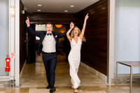 Chicago wedding couple dancing into reception