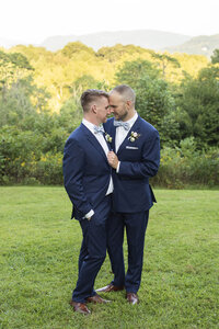 mountain view wedding Asheville, NC Twisty Maple gay couple snuggling