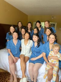 bridal party in hotel room in pajamas