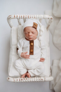 Newborn Photographer in Charleston - Infant posed for Newborn Photoshoot at Holy City Babies Portrait Studio in Charleston, SC.