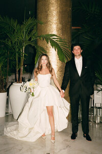 Sophisticated film photography documenting ceremony preparation during Rebecca & Kevin's fashion forward destination wedding at Miami Beach Edition luxury venue.