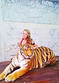 Petting tigers in Thailand