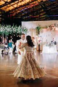 Father and daughter sharing a dance at a wedding reception.