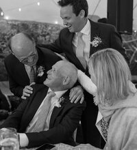 Guests mingle and laugh together during Nantucket wedding.