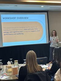 Jill Wright delivering a professional development workshop on sustainable productivity to workplace teams.