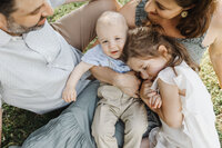 Family cuddle puddle captured during Toronto Family photos