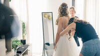 Bride with mother and sister ready at home