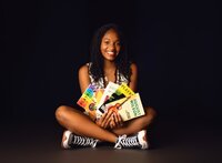 Senior portrait at the theater in Mobile, Alabama -- holding playbills