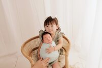 Beautiful newborn portraits in Elk Grove and Sacramento, capturing your baby's precious moments with simple elegance. Book your session today