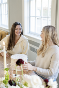 Two women designing bouquets at Maison Charlottesville. Photography by Jo Mahoney