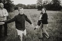 a family plays a game as a photo session in Flower Mound Texas