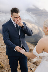 Grooms emotional reaction to seeing his bride in her dress during their elopement in yoho national park BC