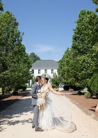 bride and groom looking at each other outside in detroit