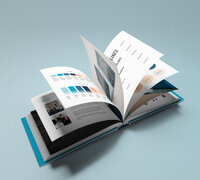 Lighthouse Leadership brand guide open to blue and orange identity spreads