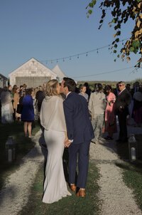 Guests enjoy outdoor cocktail hour during Nantucket wedding reception.