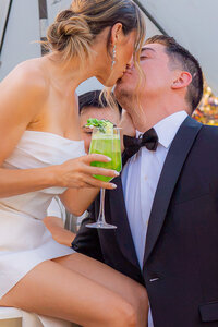 fairytale bride and groom with cocktail drink on bar at rainbow oaks ranch in sanger california