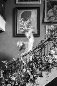 Creative black and white bridal portrait with motion blur on staircase in wedding photography in Detroit