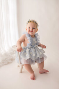Baby celebrates her first birthday with Cake Smash Pictures at Holy City Babies Portrait Studio in Charleston, SC.