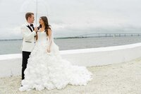 newport wedding photos by water with umbrella