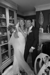Bride and Groom smile as they celebrate after wedding ceremony.