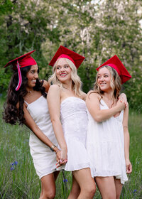 Best friends from Oregon City High School getting their cap and gown portraits done at Camassia Nature Preserve.