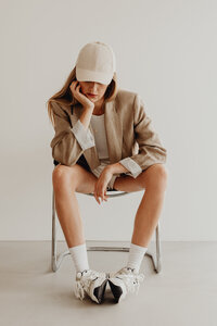 kaboompics_White top - white high-waisted shorts - long socks - sneakers - linen jacket
