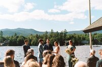 An intimate wedding ceremony on Lake Placid at a private estate during a June afternoon