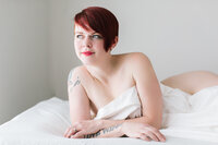 red haired woman white sheet session photographer ne lincoln nebraska