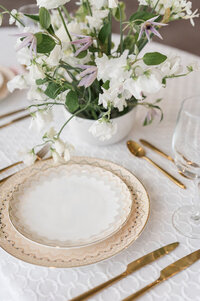 Wedding reception table set up with dinnerware, taken by Detroit Michigan wedding photographer Courtney Rudicel