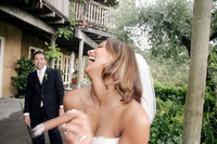 Bride and groom with a cigar at Auberge du Soleil in Napa