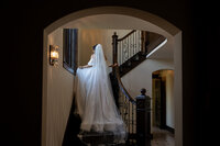 bride walking upstairs at Grand Rapids Wedding photography at Venue3Two