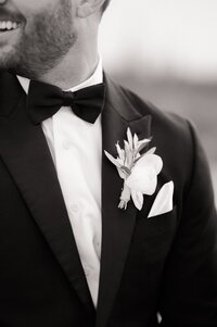 Close up of groom showing him in his tux and the boutonniere.