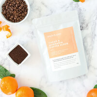 Styled product photography of coffee body scrub photographed with natural ingredients to highlight scent and texture