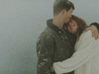 girl hugging guy in snow