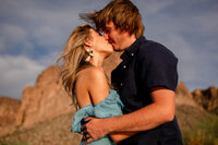 Man carrying his partner in his arms during their Saguaro Lake engagement session