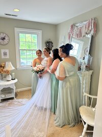 Bride with bridesmaids inside The Love Loft in Monroe, Connecticut