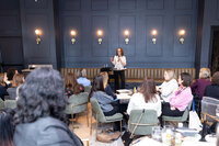 Employees participating in an interactive workplace workshop focused on time management and sustainable productivity.