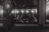 couple sharing a drink in dive bar by the beach, south kingsport, rhode island couples photographer, cinematic engagement photos, east coast couples photographer