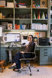 Leah Solivan sitting at her home office desk, about to record her podcast