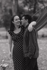 Couple hugging after proposal in Marietta.