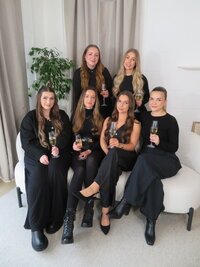 DG Collaborative team photo all all holding a glass of champagne