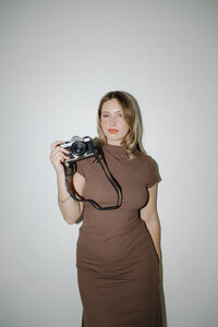 photographer holding film camera