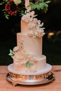Tall and white wedding cake before being cut
