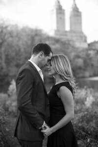 Central park engagement photos, Deborah Zoe Photography. A couple pose forehead to forehead in Central Park.