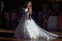 Venice Beach Los Angeles wedding photography of the bride dancing in the dark with cinematic lighting, captured in a fun documentary moment and true to life color.
