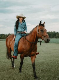 Senior portrait at Triple T Farms in Fruitdale, Alabama — riding her horse, smiling.
