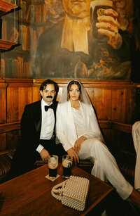 Fun documentary photos at a meaningful NYC bar during a city elopement