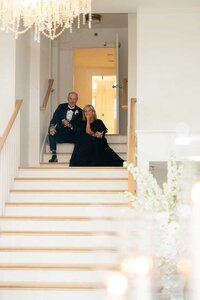 parents watch bride and groom belle mer wedding